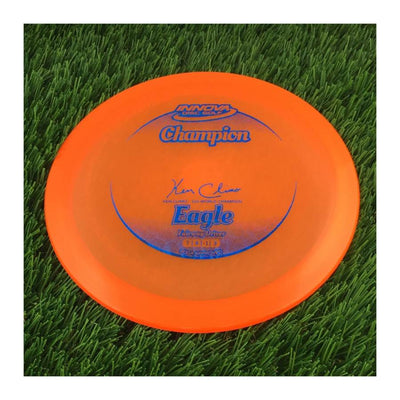 Innova Champion Eagle with Ken Climo - 12x World Champion New Stamp Stamp - 171g - Translucent Orange