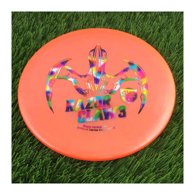 Discmania Evolution Meta Tactic with Razor Claw 3 - Eagle McMahon Signature Series Stamp - 171g - Translucent Orange