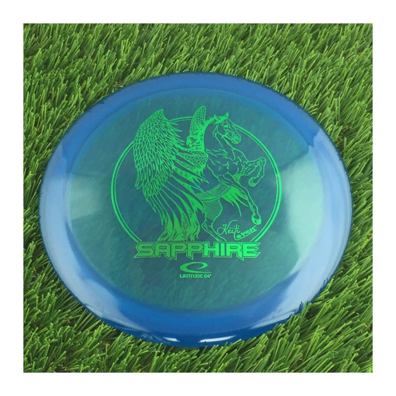 Latitude 64 Opto Sapphire with Keiti Tatte Team Series 2023 Stamp - 164g - Translucent Blue