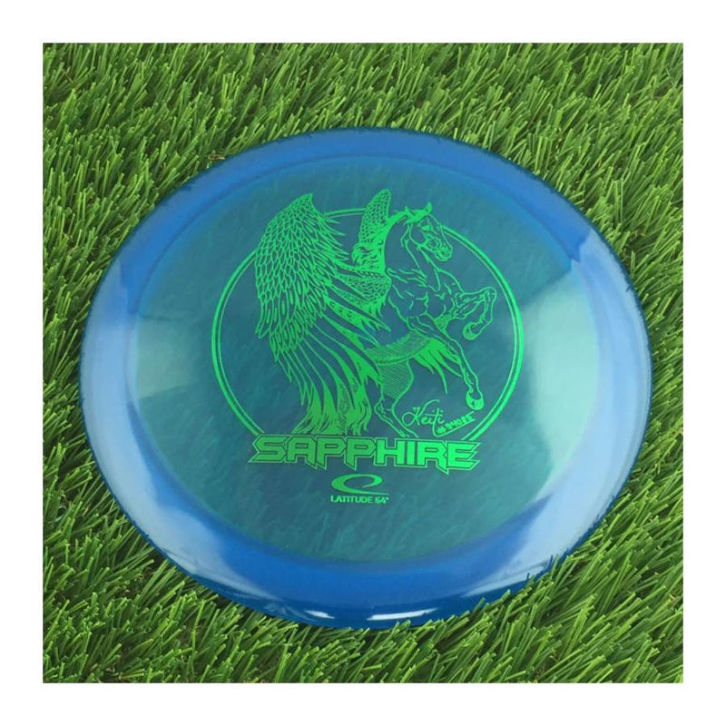 Latitude 64 Opto Sapphire with Keiti Tatte Team Series 2023 Stamp - 164g - Translucent Blue