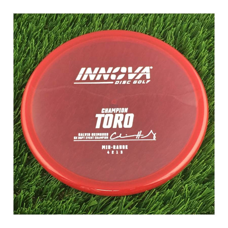 Innova Champion Toro with Calvin Heimburg 7X DGPT Event Champion Stamp - 171g - Translucent Red