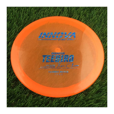 Innova Champion Teebird with Ken Climo 12x World Champion Burst Logo Stamp - 175g - Translucent Orange