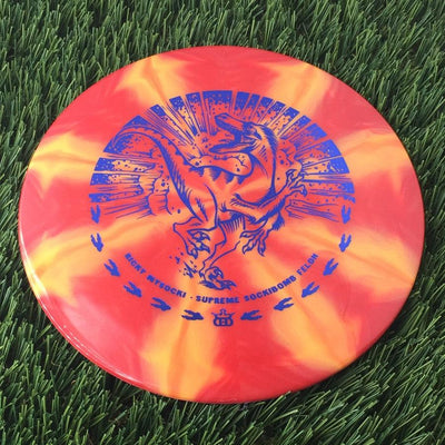 Dynamic Discs Supreme Burst Sockibomb Felon with Ricky Wysocki - Runnin' Raptor Stamp - 175g Orangish Red