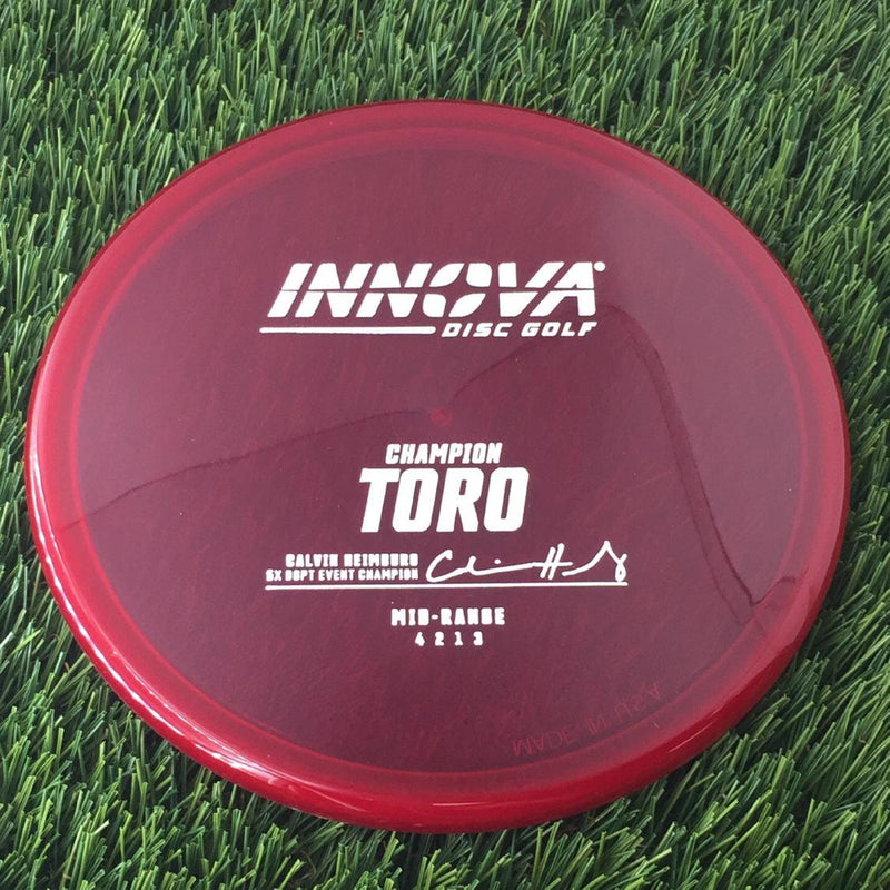 Innova Champion Toro with Calvin Heimburg 7X DGPT Event Champion Stamp - 171g - Translucent Red