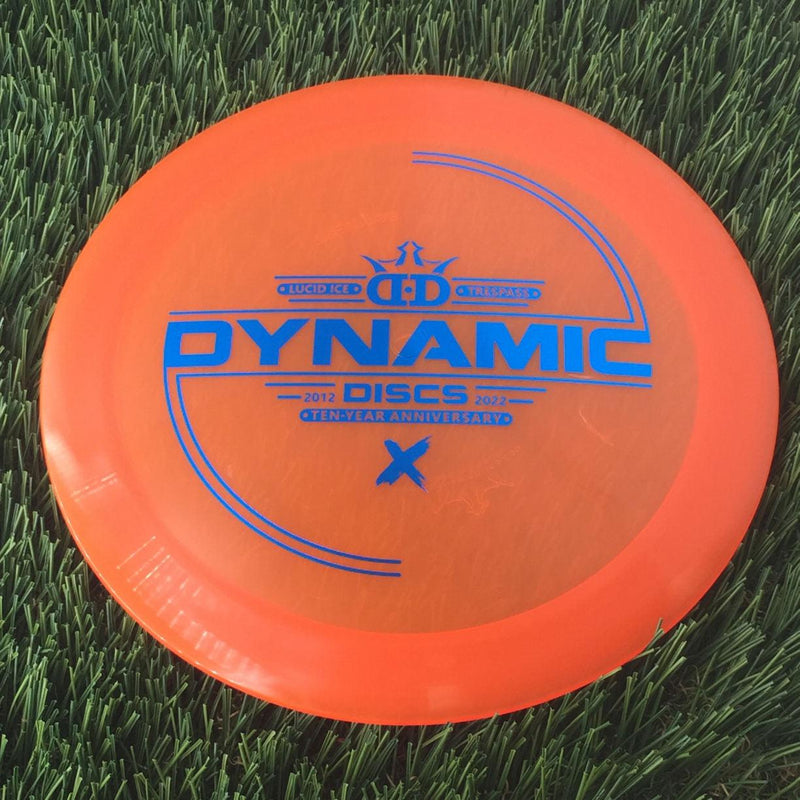 Dynamic Discs Lucid Ice Trespass with Ten-Year Anniversary 2012-2022 Stamp - 173g - Translucent Orange