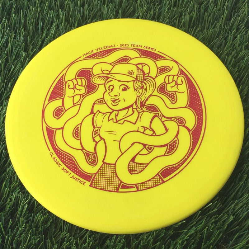 Dynamic Discs Classic Soft Justice with Macie Velediaz 2023 Team Series Stamp - 173g - Solid Yellow