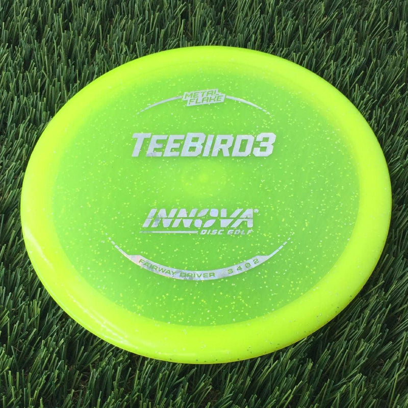 Innova Champion Metal Flake Teebird3 with Burst Logo Stock Stamp - 169g - Translucent Yellow