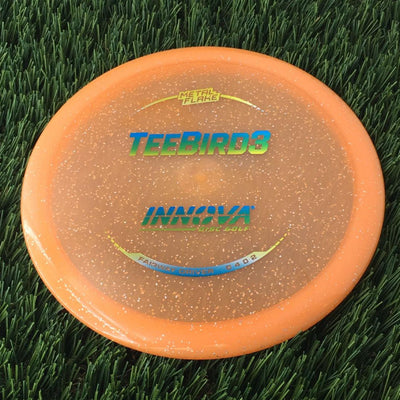 Innova Champion Metal Flake Teebird3 with Burst Logo Stock Stamp - 175g - Translucent Orange