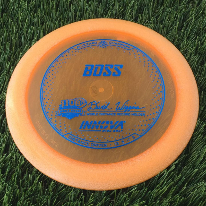 Innova Champion Blizzard Boss with 1108 Feet - David Wiggins - World Distance Record Holder Stamp - 143g - Translucent Orange